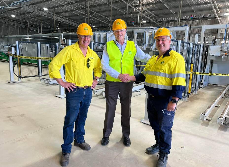 Rob de Fégely AM (left) - director of Margules Groome Consulting and proposed South East NSW Forestry Hub Manager, with Senator Jim Molan (centre) shaking hands with Malcolm McComb (right), chair of Eden Regional Forestry Hub. Photo supplied.