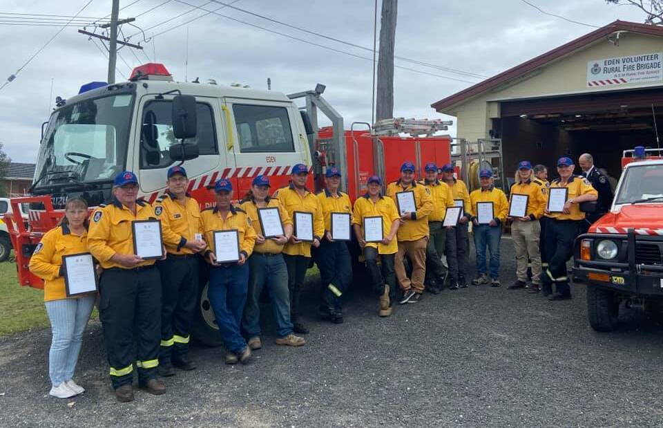 Eden Rural Fire Brigade members with their Premier's citations for the role they played protecting their communities in the horror bushfire season of 2019-2020. Photo supplied.