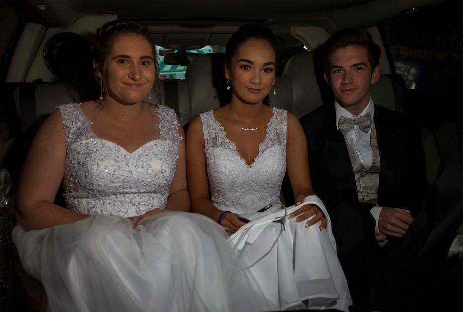 2019 debutantes Mia Edwards, Krystal-Ana Cruse and Brock Doyle headed off to the ball in a limousine.