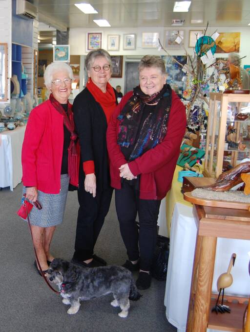 END OF AN ERA: Daphne Lister, Di Swane and Helen Hillier (and 'mascot' Ruby) will treasure the happy memories of almost 13 years managing Art on Imlay. Photo: Leah Szanto
