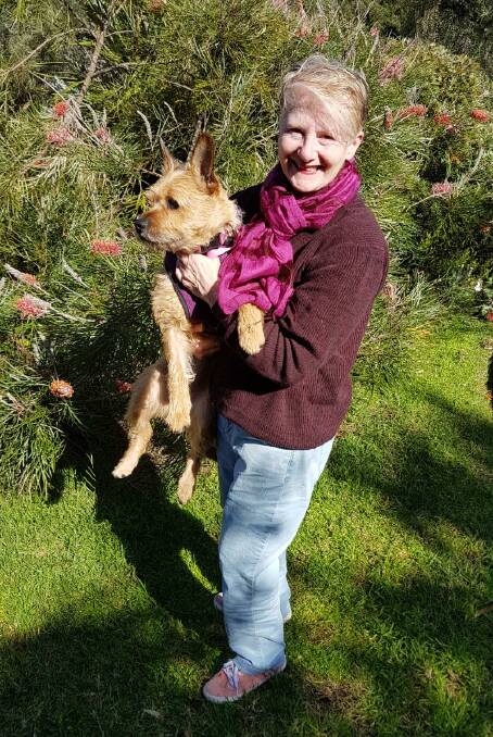 Tura Beach resident Olga Walker with newly adopted terrier cross, Megsi.
Photo supplied.