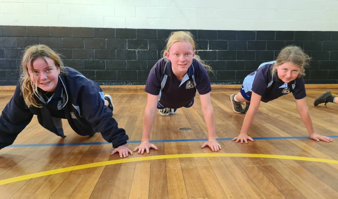 Eden Marine High School year 7 students Ava Loader, Jayda Jackson and Colin Lackey, pushing their limits for a good cause. Photo supplied.