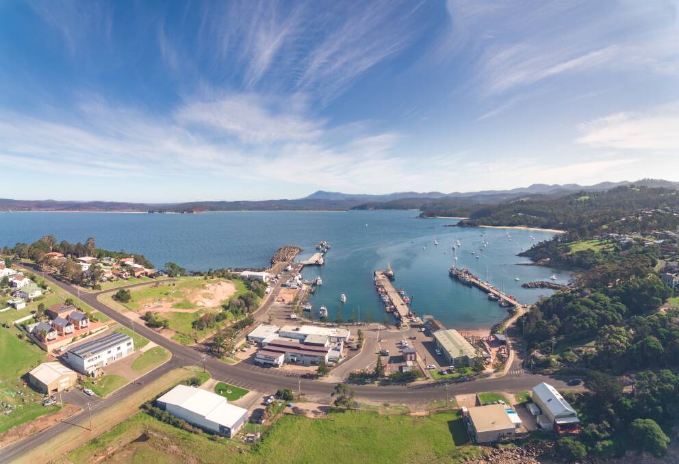 Aerial shot of Snug Cove and the wharf precinct taken prior to the Welcome Centre construction and the co-op demolition. Photo: DoubleTake Photography
