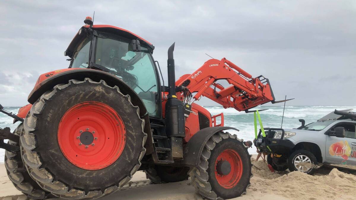 Kindness of strangers: After a treacherous two-day ordeal, a tractor managed to pull them out. 