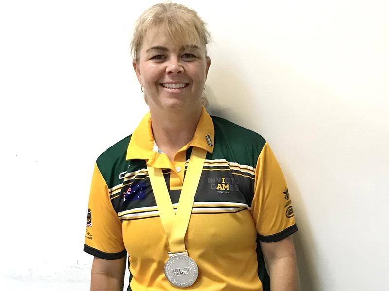 Australian powerlifter Nicole Bradley has lifted 70kg to take home Invictus Games silver.