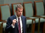 Dan Tehan has criticised Labor's "big Australia" policy and flagged a plan to cut migration. (Lukas Coch/AAP PHOTOS)