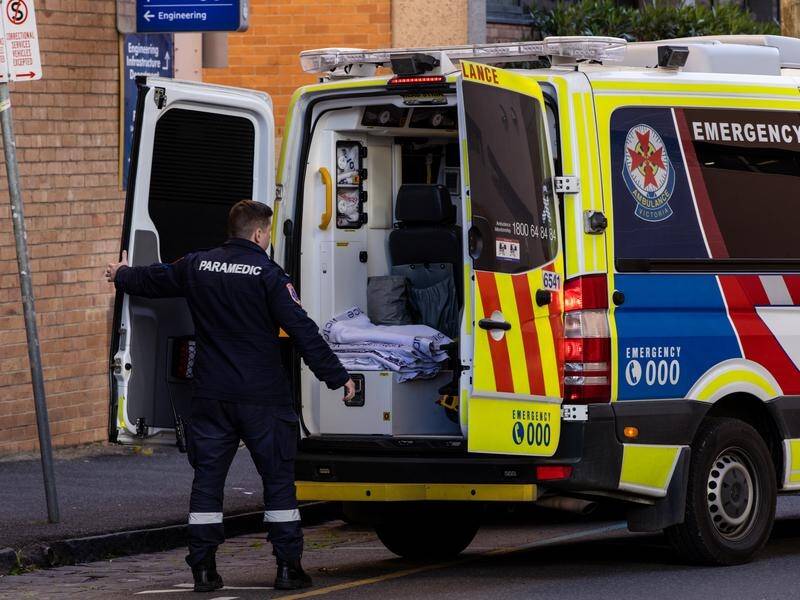 Australia is approaching a death toll of 12,000 from COVID-19 as infections spike. (Diego Fedele/AAP PHOTOS)