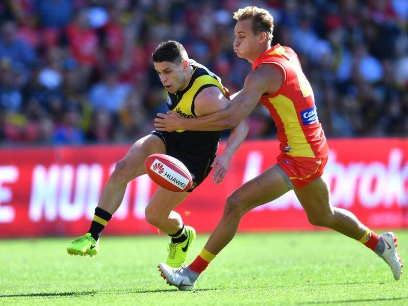 Tiger Dion Prestia (left) has hamstring soreness and is doubtful for the match against Essendon.
