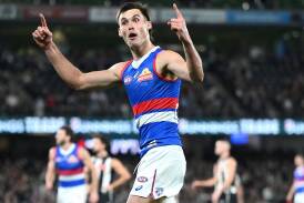 Sam Darcy, of Western Bulldogs, celebrates scoring a goal against Collingwood Magpies in Melbourne. (Joel Carrett/AAP PHOTOS)