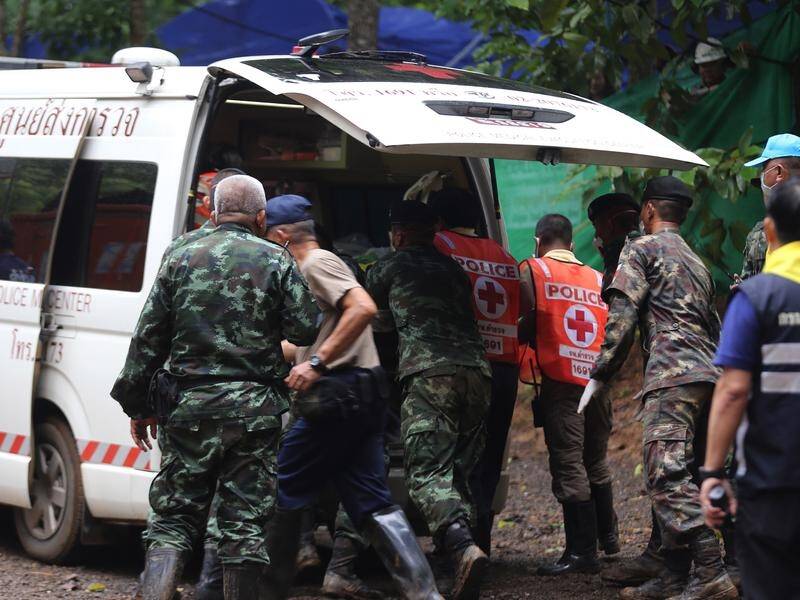 Four boys and their coach remain in the Thai cave with authorities planning the next day's rescue.