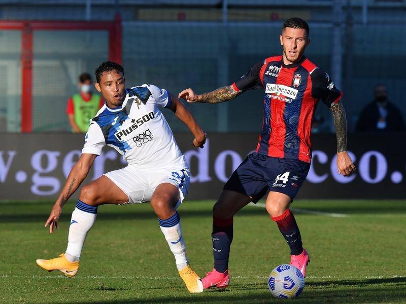 Luis Muriel (l) scored twice at Crotone to thrust Atalanta into second place in Serie A.