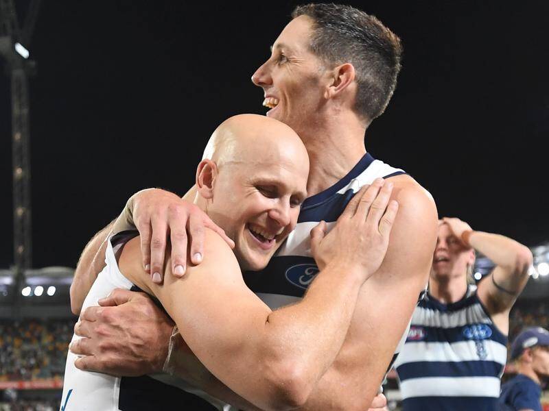 Geelong's Harry Taylor (r) has joined Gary Ablett (l) into retirement.