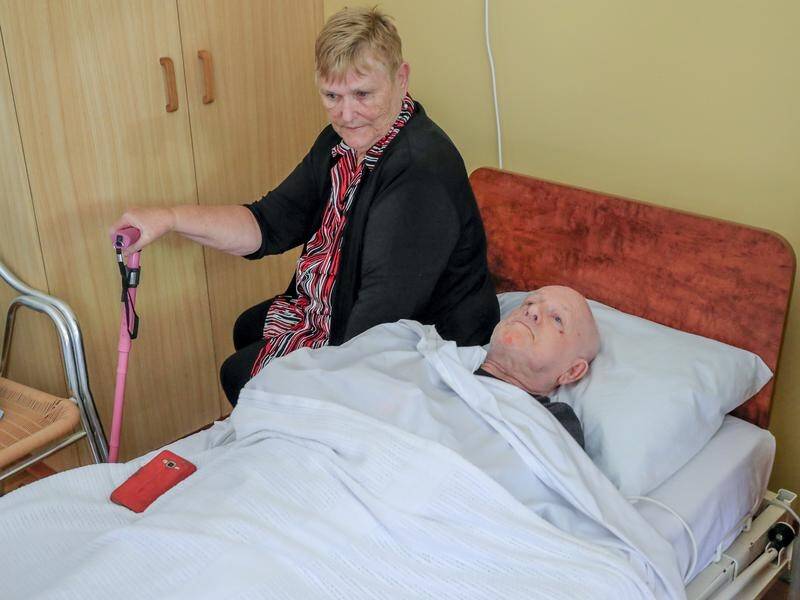 Lorraine Cook (L) says her husband John (R) is distressed after being moved from his aged care home.