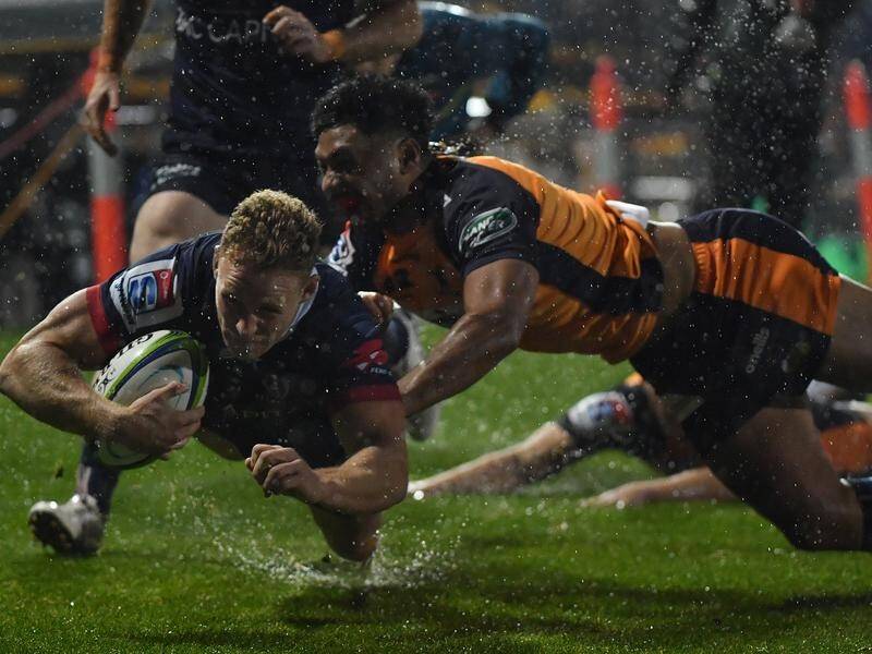 Reece Hodge scores a try for the Rebels in their upset 30-12 win over the Brumbies on Friday.