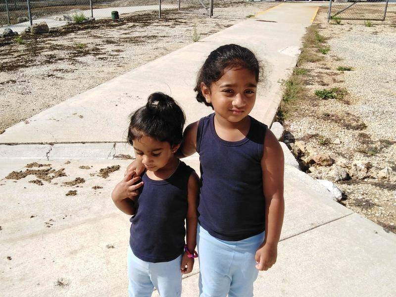 Kopika and Tharunicaa, the daughters of the Biloela family, at the Christmas Island centre.