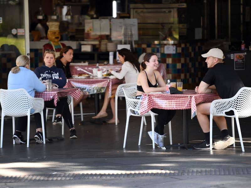 Queenslanders are being urged to practice social distancing as cases rise south of the border.