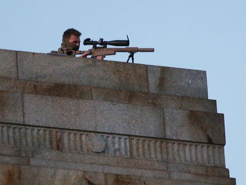 A sniper on the roof at the Shrine of Remembrance during the Anzac Day dawn service in Melbourne.