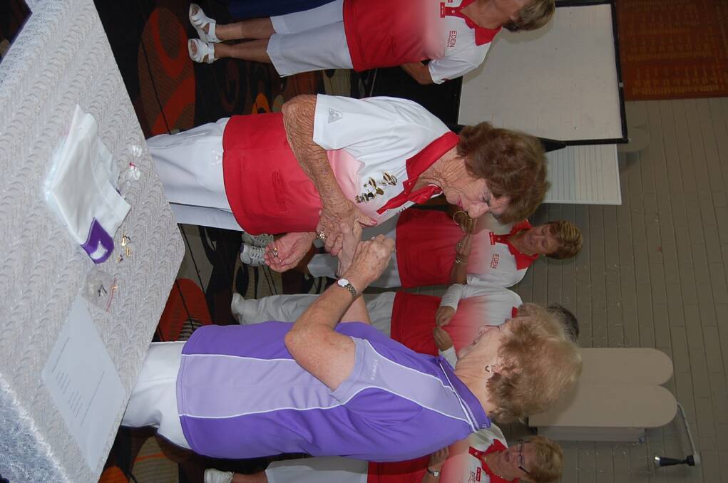 Peg Davey collects her winner’s badge from district president Beryl McGrath-Smith on Tuesday morning’s presentation.