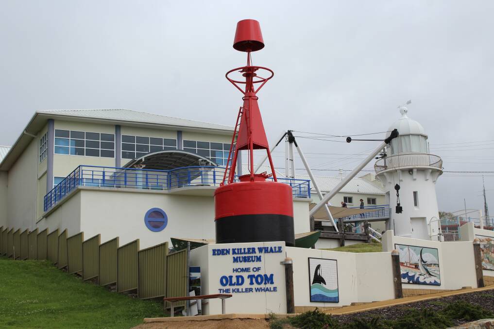 The Eden Social Services Club Inc. (Essci), Nik's Cranes and Eden Slipway Services install a red lateral marker buoy in front of the Eden Killer Whale Museum on Monday morning.