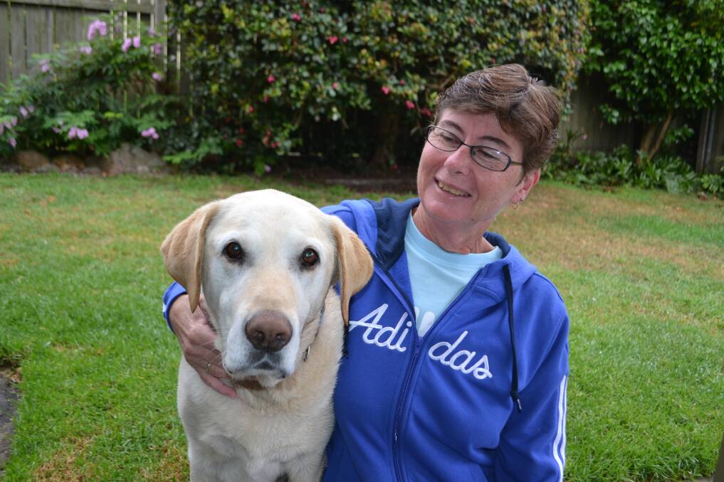 Raffles the Labrador is back to bouncing good health four weeks after major surgery to remove cancer from his intestine. He is pictured with his ‘mum’, Robyn Robinson of Pambula.