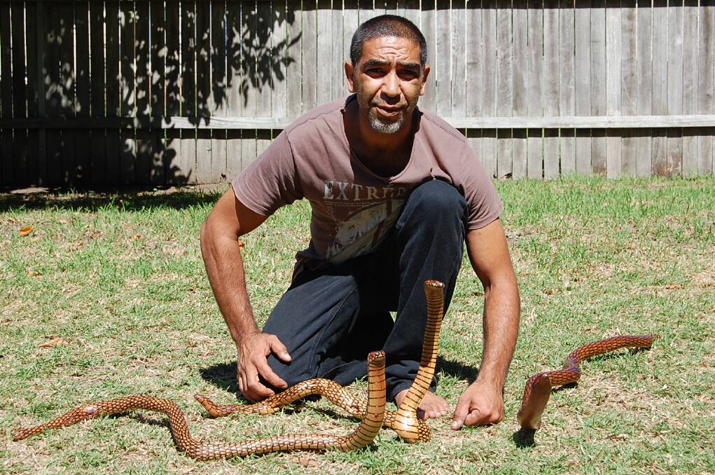 Eden sculptor Darren Mongta with his prize-winning serpents, which won him the South East Arts encouragement award at Bermagui’s Sculpture on the Edge.