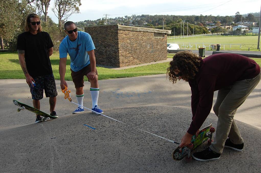 Local skaters and tradespeople (from left) Reece Warren, Zac Robin and Kel Williams measure up the Eden skate park on Friday, as plans for a revamp continue. Campbell Page Eden recently held a raffle to raise funds for the project,