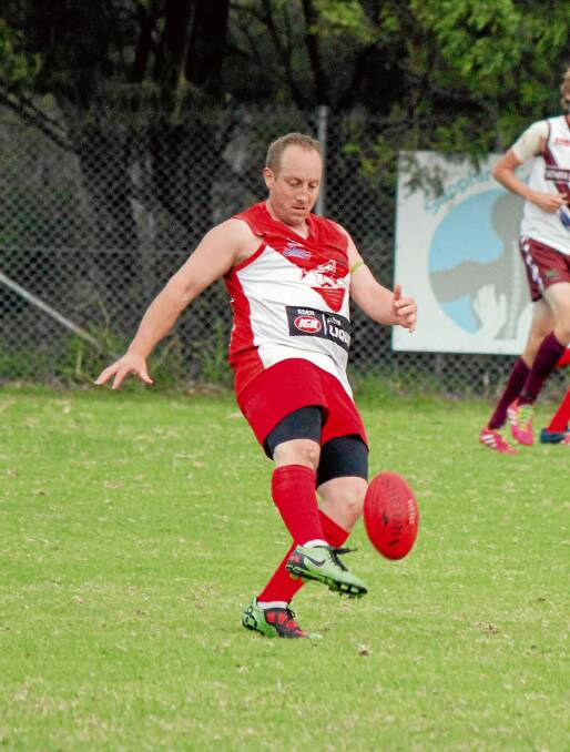 • Whaler Pete Russell puts boot to ball against the Pambula Panthers on Saturday. 