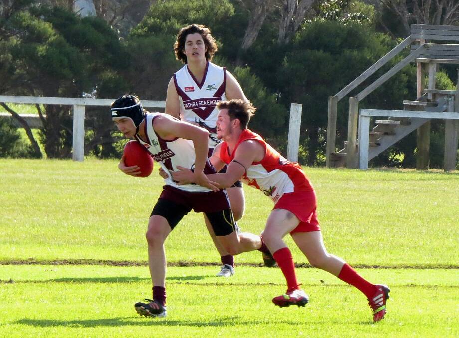 • Eden Whaler Ben Seide grapples with his Tathra opponent on Saturday. Photo: Shirley Rixon