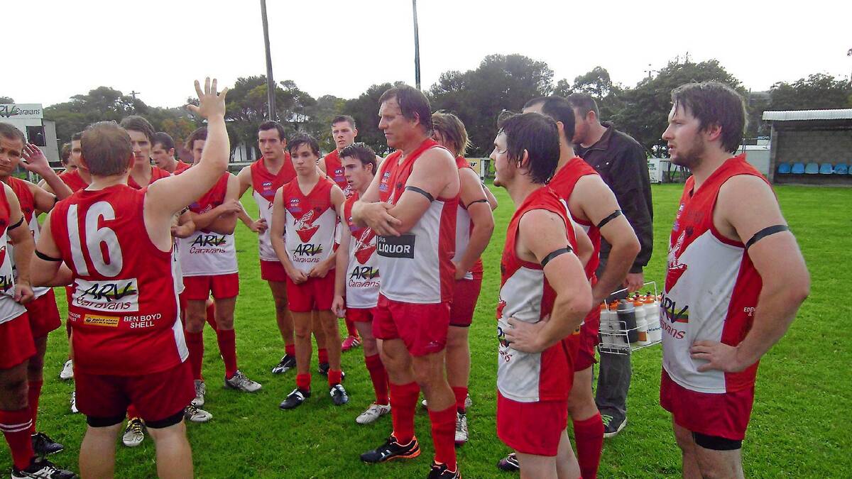 • The Whalers talk strategy at halftime against the Bermagui Breakers on Saturday. 