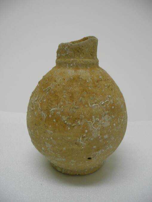Believed to be a Portuguese wine urn, it was trawled up by local fisherman Alan McCamish of Mark M in waters off Gabo Island in 1999.  Thermoluminescent dating conducted by Mr Price in 2006 dated it at 350 BP (equalling 1600 AD). Photo courtesy of Eden Killer Whale Museum.  
 