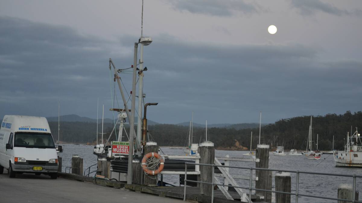 Moon set, sun rise in Eden on Wednesday morning as the fishing trawler Melisa headed home after three days at sea.
