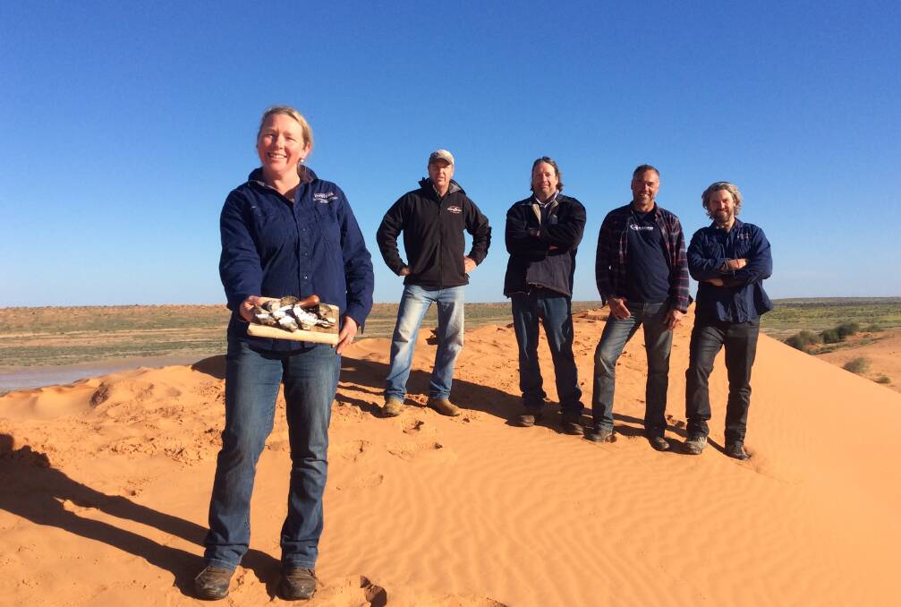 Delicious: Merimbula and Pambula Lake oyster farmers Sue McIntyre, Stirling Cullenward, Brett Weingarth, Peter Ferguson and Greg Carton with some of their gourmet oysters in the Australian Outback in Queensland. 
