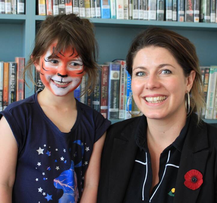 Library fun: Six and a half year old Tori with Eden library customer information officer Kate Liston at the Open Day. Picture: Melanie Leach