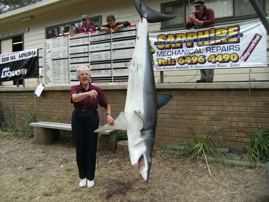 Eden Amateur Fishing Club’s Gwen Bobbin looks on as this 120kg game shark, snapped up by Scott Henriksen, is weighed.