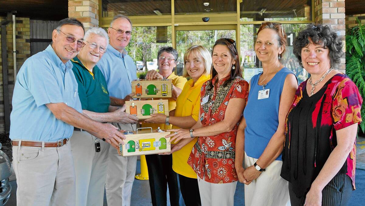 • Members of the Bega District Woodcraft Association, Tony Taylor, left, Lindsay Pearson and Shane Castles gave special boxes used in the care of dementia patients to volunteer carers Beth Claydon and Alison Gribble, clinical nurse co-ordinator in dementia, Cath Bateman, volunteer co-ordinator, Sally Cantrill and acting nurse manager, Cathy Staples.