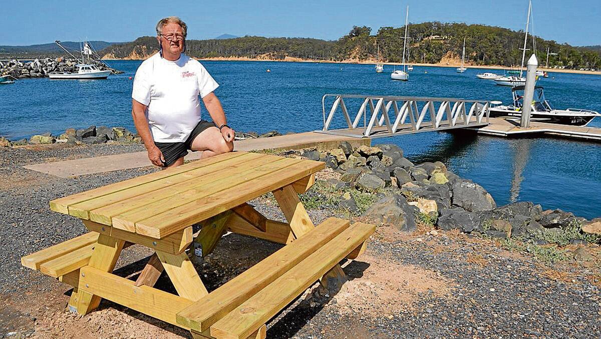 TAKE A SEAT: Fitz Drenkhan of Eden Amateur Fishing Club is very proud of the new picnic tables and benches around the Quarantine Bay boat ramp. 