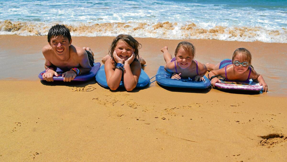 • The Lamont family from Queanbeyan found a great way to beat the heat and stay cool in the surf at Aslings Beach this week. From left they are AJ (14), Taylor (9), Zoe (7), and Chenille (6) Lamont.