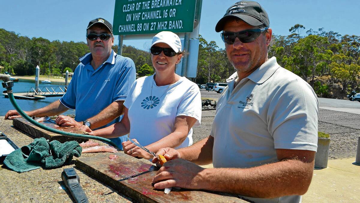 • From left: Dave and Kerry Hughes from Lakes Entrance and Michael Young from Orbost are enjoying fishing in Eden over the summer.  Their catch of flathead, combined with a “few coldies”, was the plan for a magnificent al fresco dinner on Tuesday.  