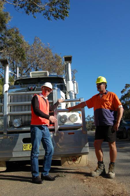 Ross Hampton CEO of AFPA, pictured with truck driver Raymond Mitchell, is in Eden today in talks to change how the government thinks about the timber resource across Australia