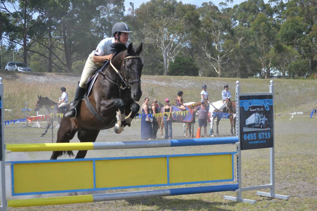 Tom Otton on Spooks. Tom took out second, third and fourth placings on different horses in the 1 metre show jumping. 